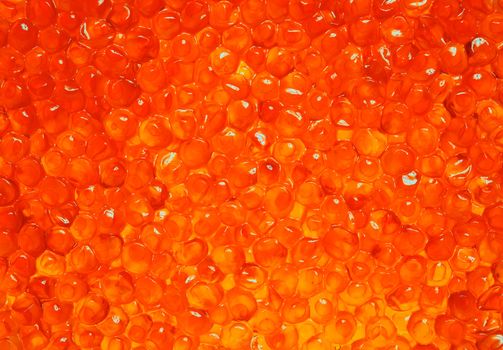 Tasty delicious red soft caviar as background 