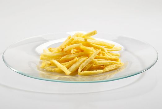 Fried potatoes on the plate over white background