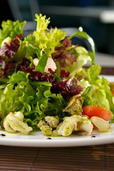 Healthy Seafood Salad with shrimps,octopus, mussels and cherry tomatoes. Macro 