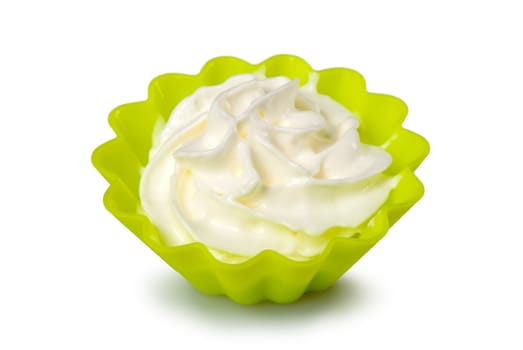 Portion of whipped cream over white background. Shallow DOF