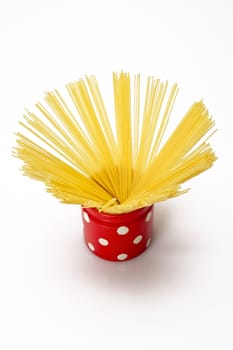 Spaghetti inside a red jar isolated on white background