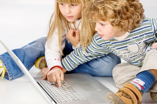 Curl hair boy and blue hair girl turning on computer