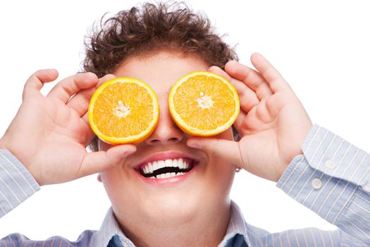 Happy man with slices of orange on his eyes, isolated on white background