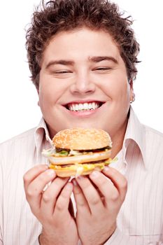 Happy chubby holding a hamburger, isolated on white