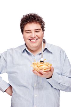 Happy young chubby man with French fries in dish, isolated on white