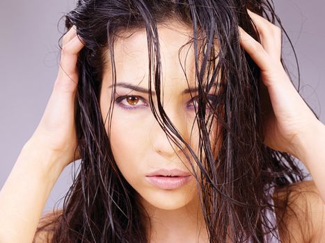 Portrait of a pretty woman with wet hair