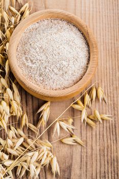 Oat meal in bowl on the wooden table