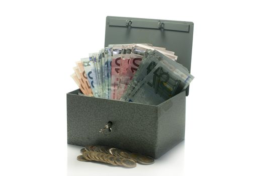 strongbox with euro money isolated on white