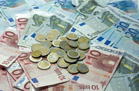 euro money paper and coins on ioalted white