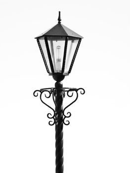 The isolated black metal streetlight whith a bulb