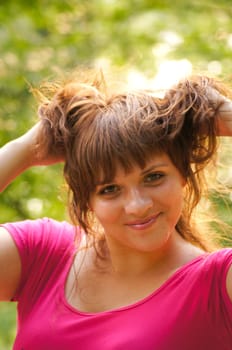 The young cheerful girl on walk