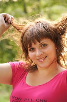 The young cheerful girl on walk