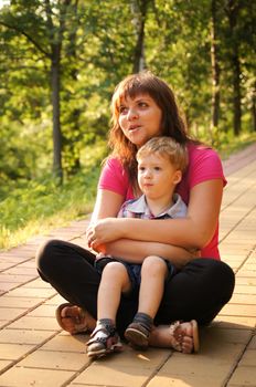 The little boy with mum on walk