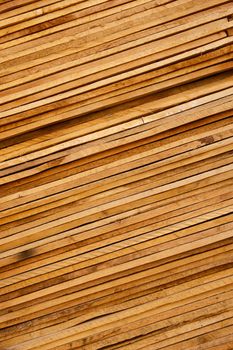 Wooden planks stacked tightly together on a slant
