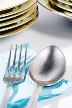 Stock photo: an image of a spoon and a fork with plates