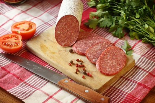 Close up of  salami sausage on kitchen table 
