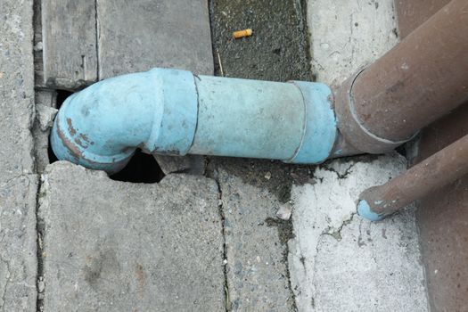 Photo of Sewage pipe for drain water and Garbage into a Concrete drain.