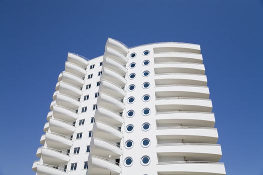 White residential building against the blue sky