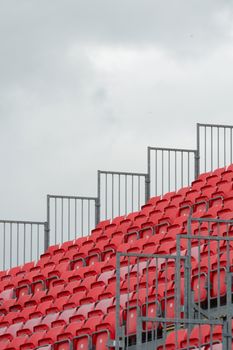 Empty grandstand with grey sky