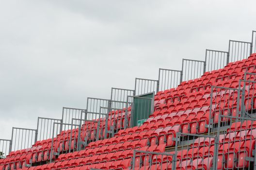 Empty grandstand with grey sky