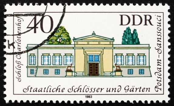 GDR - CIRCA 1983: a stamp printed in GDR shows Charlotenhoff Palace, Sanssouci, Summer Palace of Frederick the Great, King of Prussia, Potsdam Gardens, Germany, circa 1983