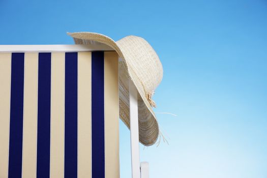 straw hat in a beach chair