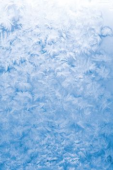 Light blue frozen window glass background