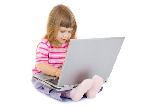 Little smiling girl with laptop isolated