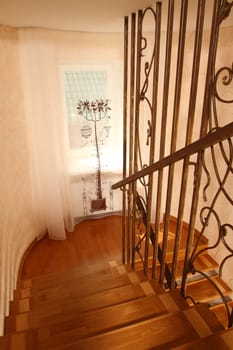 view of a window with a beautiful curtain from a ladder from top to down, a vertical shot