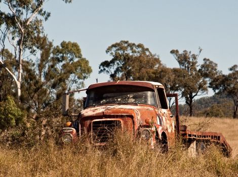 Australian outback rusty old farm truck in paddock