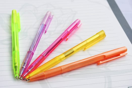 Color pens on the  writing-book