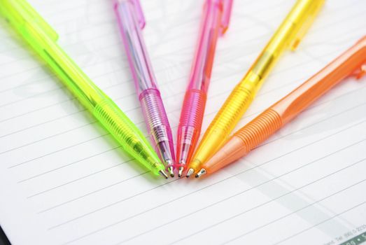 Color pens on the  writing-book