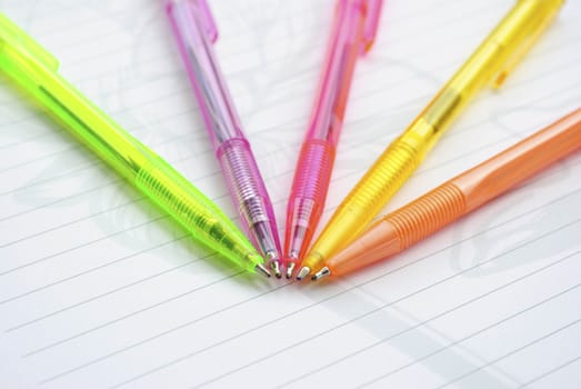 Color pens on the  writing-book