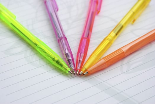 Color pens on the  writing-book