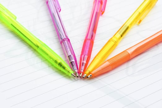 Color pens on the  writing-book
