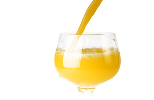 fresh brightly yellow orange juice in glass on a white background