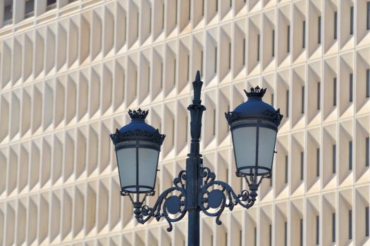 lighthouse on the background of the new building, Malaga,