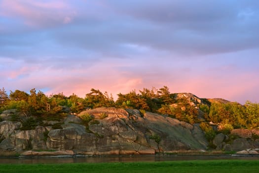 The skerry landscape in Maerrapanna lit by the evening sun in Southern Norway close to Vikene