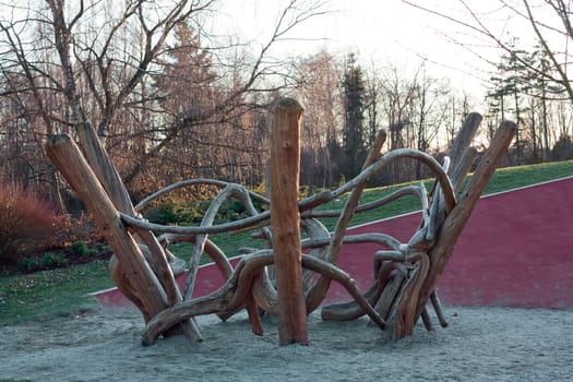 Playground ceated from old dry logs at sunset.