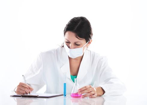 a young woman researcher working with chemicals