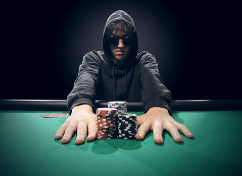 Professional poker player betting everything on one hand