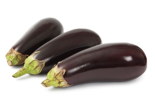 Photo of three isolated eggplants over white background.  Shadow visible.
