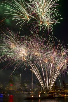 Fireworks Display Along Willamette River with Portland Oregon Skyline at Night