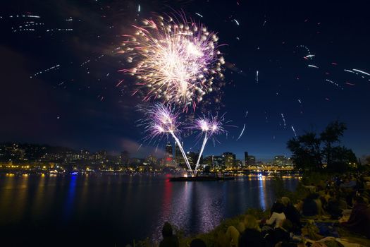 People Watching Fireworks Display Along the Banks of Willamette River in Portland Oregon