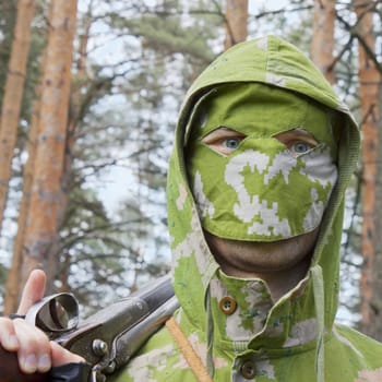 Look of a man in a camouflage mask