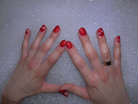 Photo by painted fingernails in the bath foam.