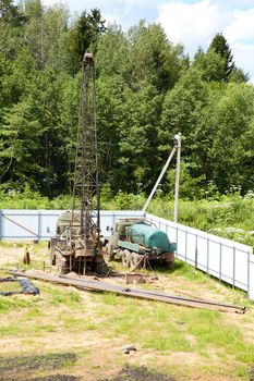 Drilling of a chink by  derrick in the afternoon