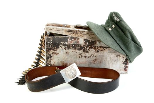 Machine-gun tape in  box of  kepi and  belt  German soldier on a white background
