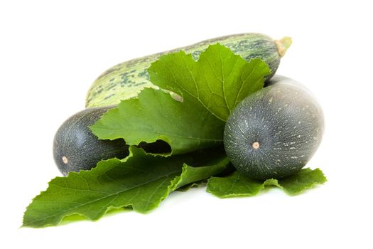 Vegetable marrows with green sheet isolated on a white background