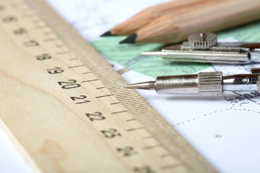 Topographic map of district with  measuring instrument,  ruler and a pencil